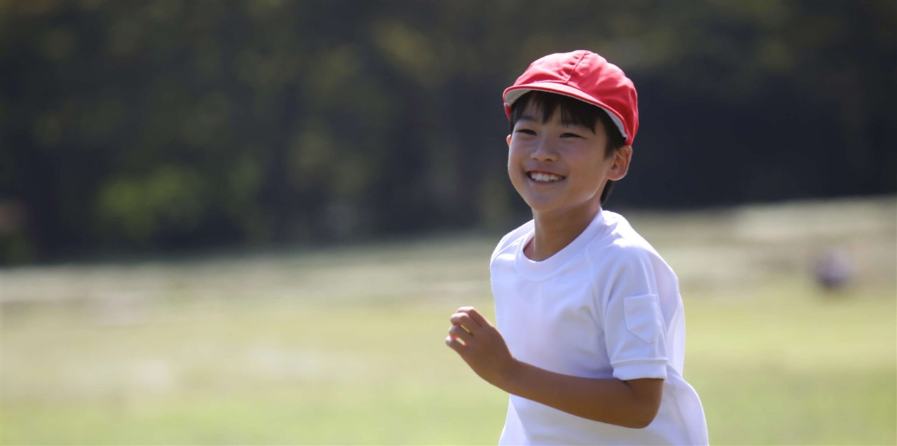 Children running together at SGIS Early Years